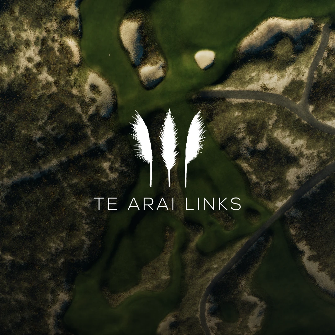Aerial view of a golf course with three stylized white feathers above the text "Te Arai Links" on overlay.