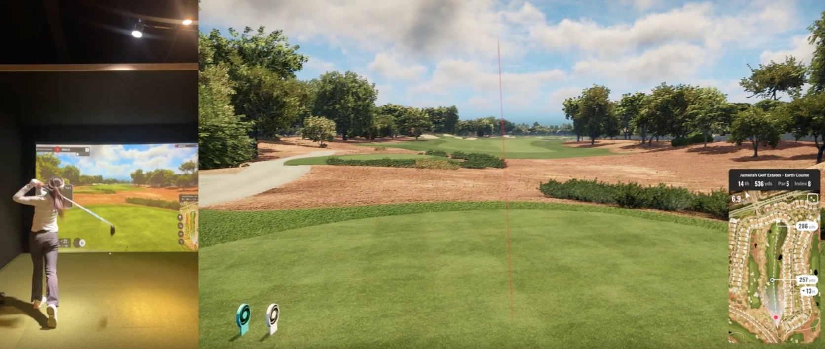 A golfer swings indoors next to a virtual golf simulator displaying a sunny, green golf course with a map and stats overlay.