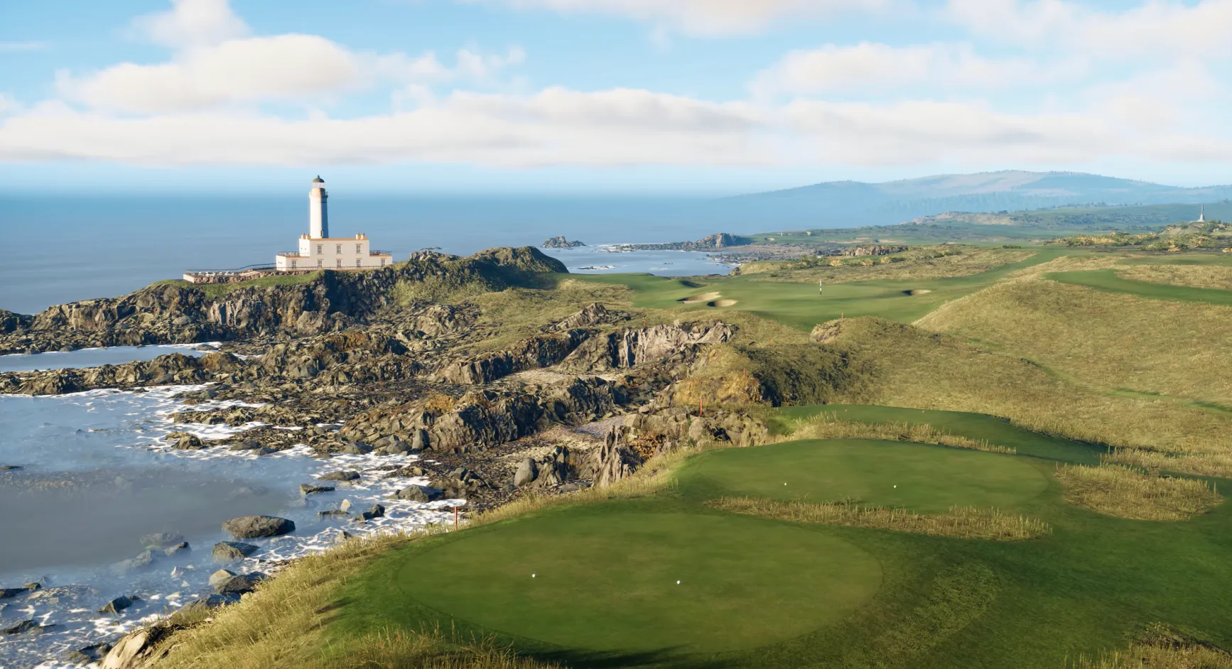 Coastal golf course with a lighthouse on a rocky shore, surrounded by ocean waves and grassy hills under a partly cloudy sky.